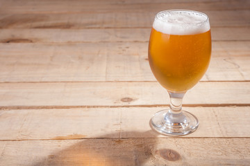 Beer glass on wood