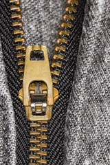 Zipper on black jeans extreme close up - Macro photo of zipper on black denim