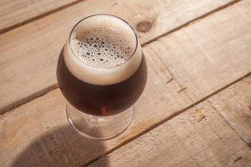Dark beer on wood