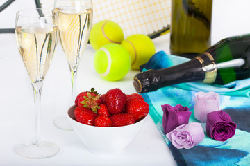  Strawberries and champagne with tennis equipment on Wimbledon tournament