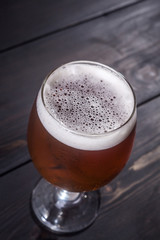 Amber ale on dark wood