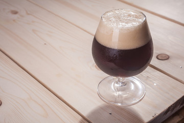 Dark beer on wood table