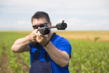 Fototapeta premium Man with air gun is aim