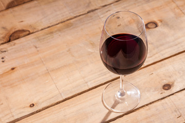 Glass of wine on wood