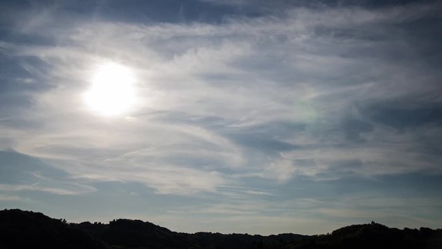 Time-lapse of sun moving over hills (no flickering and birds)