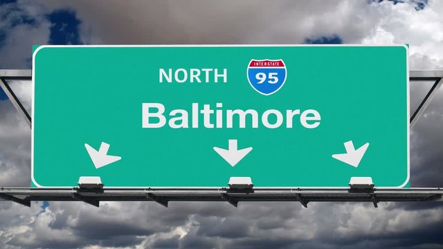 Baltimore Interstate 95 overhead highway sign with time lapse clouds.