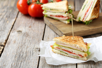 Tasty and fresh sandwiches on a grey wooden table
