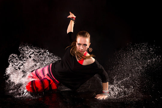 girl dancer glides on her knees in aqua studio