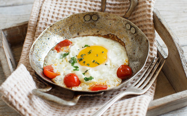 Fried egg on an old frying pan