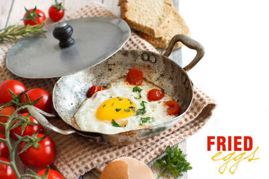 Fried egg on an old frying pan