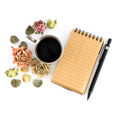 Cup of coffee, sketchbook, pencil and dried flowers. Flat lay, top view