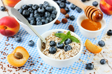 Healthy food concept - oatmeal granola with berries, fruits