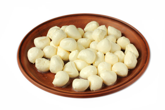 Mozzarella mini balls in a bowl isolated