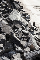 many old asphalt pieces close up removed from road