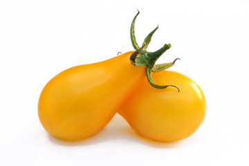 Two yellow tomatoes isolated