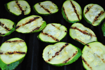 Grilling Fresh Green Zucchini Squash on a Hot Summer Day