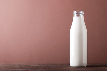 bottle of milk chocolate on background
