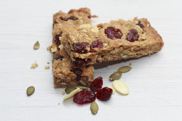 Mueslibar on white wooden background