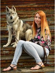 Lovely Woman Posing With a Wolf