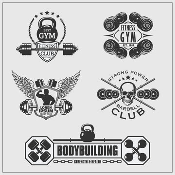 Set of gym emblems, labels, badges and logos.