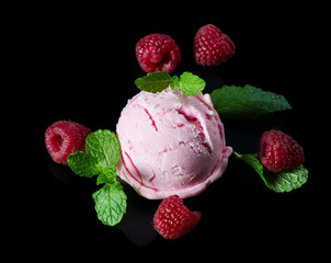Raspberry ice cream with fresh berries and mint.
