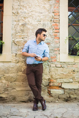 Urban business man talking on smart phone at walking. © zadorozhna