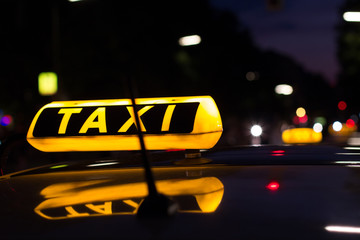 taxi sign at night , taxi cars