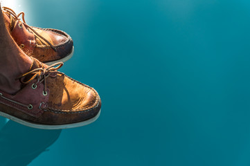 Sailing Shoes Reflecting On Crystal Clear Seawater
