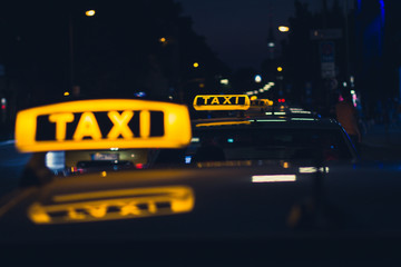 taxi sign at night , taxi cars