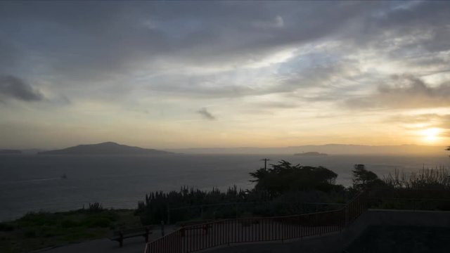 Dramatic left pan time lapse of Golden Gate Bridge and bay