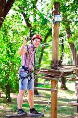 adventure climbing high wire park - people on course in mountain