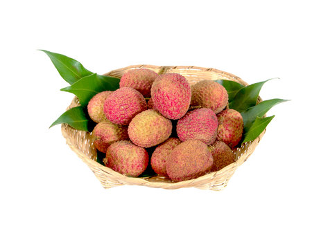 Fresh lychees in a bamboo basket isolated on white background