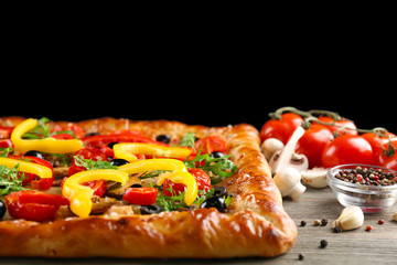 Freshly homemade pizza on black background
