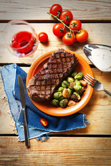 Grilled steak with vegetables, closeup