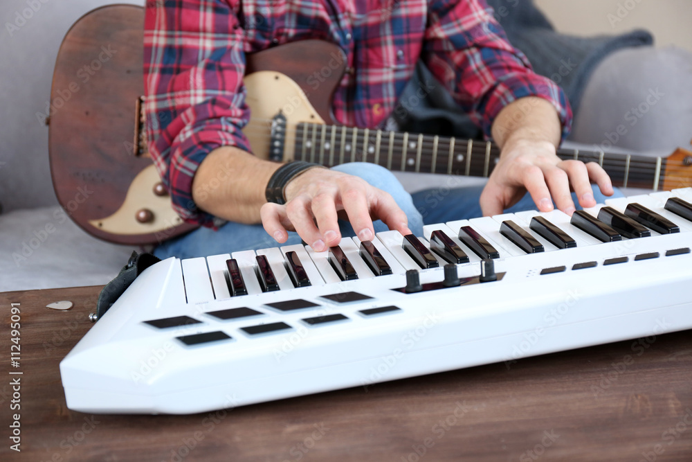 Canvas Prints Man with guitar and synthesizer closeup