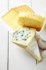 Set of fresh dairy products on white wooden table