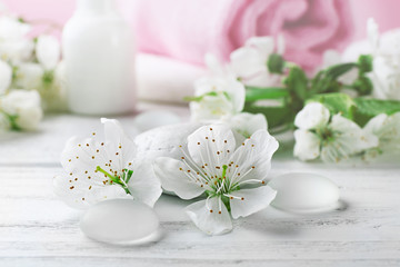 Fototapeta na wymiar White flowers on wooden table
