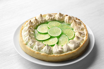 Lime cake on wooden background