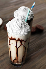 Fresh milk cocktail on wooden background