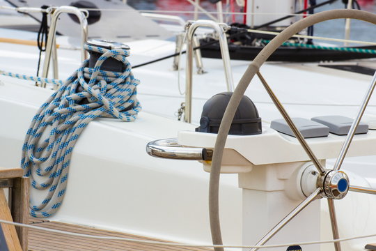 Yachting, coiled rope on sailboat, details of yacht