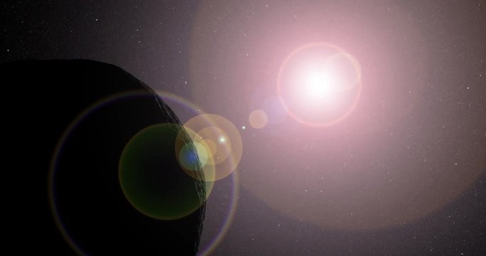 The sun bursts into view over Vesta's horizon and illuminates the surface. Data: NASA/JPL.
