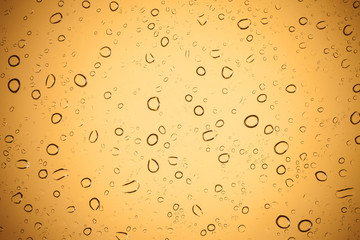 Water droplets on brown glass for a background, Raindrops on bro