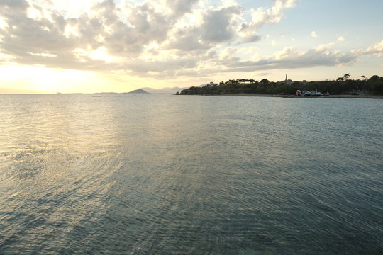 Sea Sunset in Aegina, with wievs to Kolonna ancient ruins, Greec
