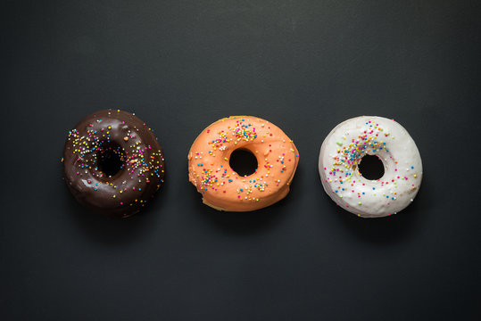 Donuts composition Place on the wooden floor A white background