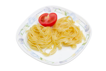 Boiled noodles and half fresh tomato on dish