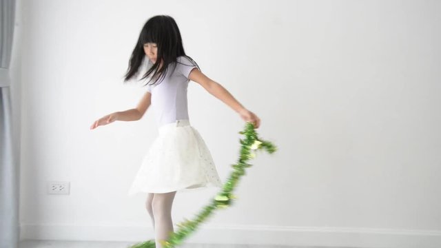 Cute girl jumping and spinning at home