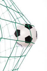 soccer ball in green goa
