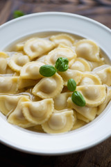 Close-up of ravioli served in bouillon, selective focus