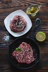 Top view of raw tuna fillet with black and white sesame seeds