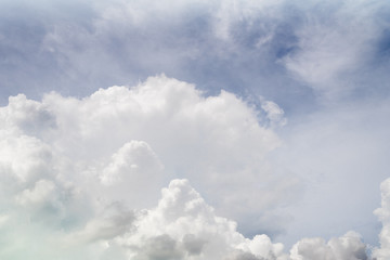 Blue sky background with white clouds.